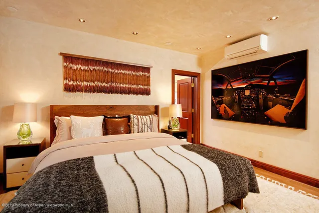 a bedroom with a bed and walk in closet