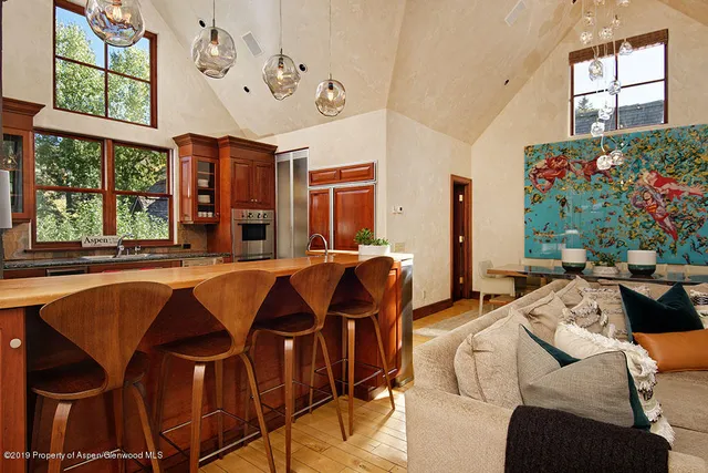 a view of a dining room with furniture window and outside view