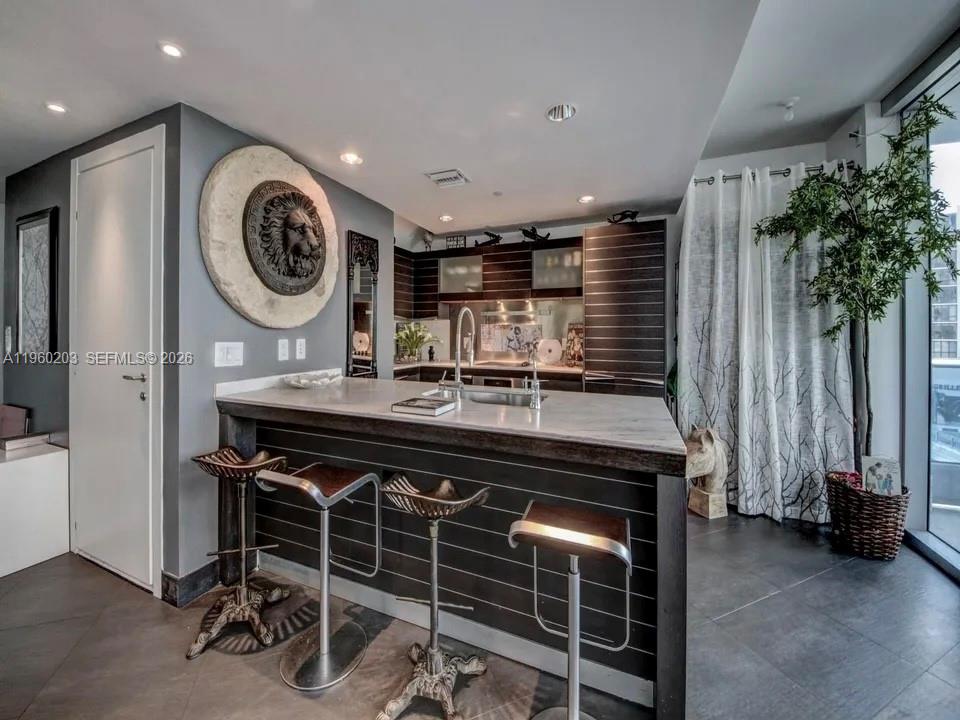 200 Biscayne Blvd Way, Unit 501 Miami, FL 33131 - Photo 4 of 15 a kitchen with a sink cabinets and window