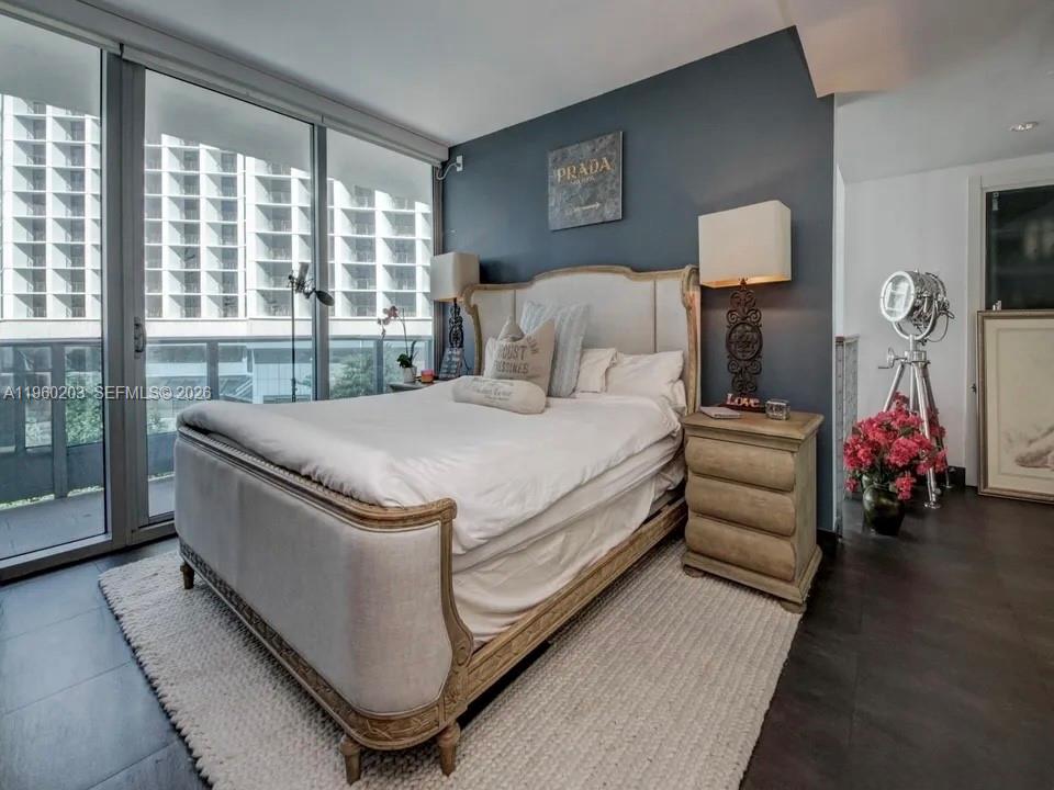 200 Biscayne Blvd Way, Unit 501 Miami, FL 33131 - Photo 9 of 15 a bed room with a bed and a chair