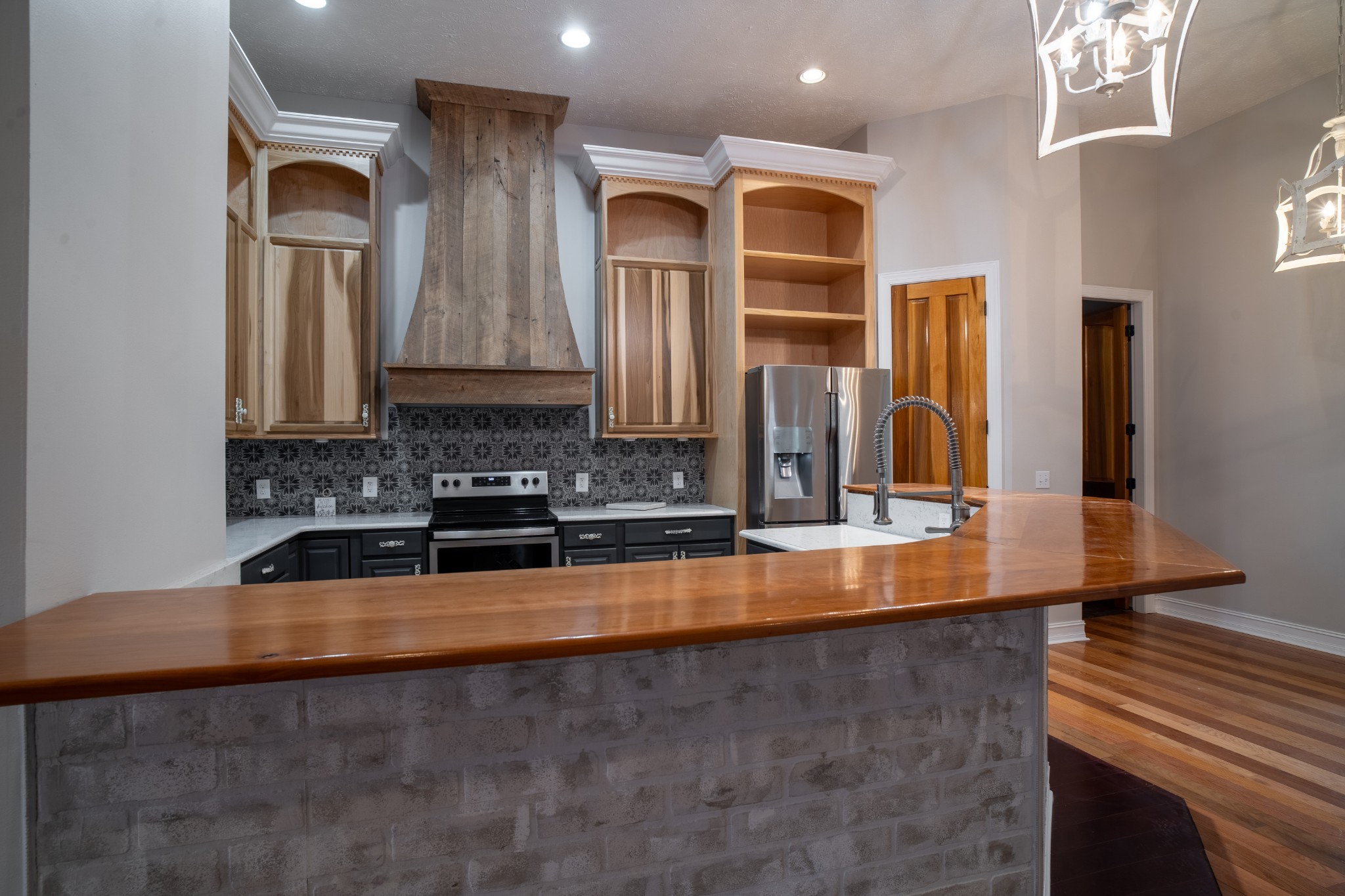 550 Laurel Crown Road Manchester, TN 37355 - Photo 64 of 87 a large kitchen with stainless steel appliances a large counter top and a stove