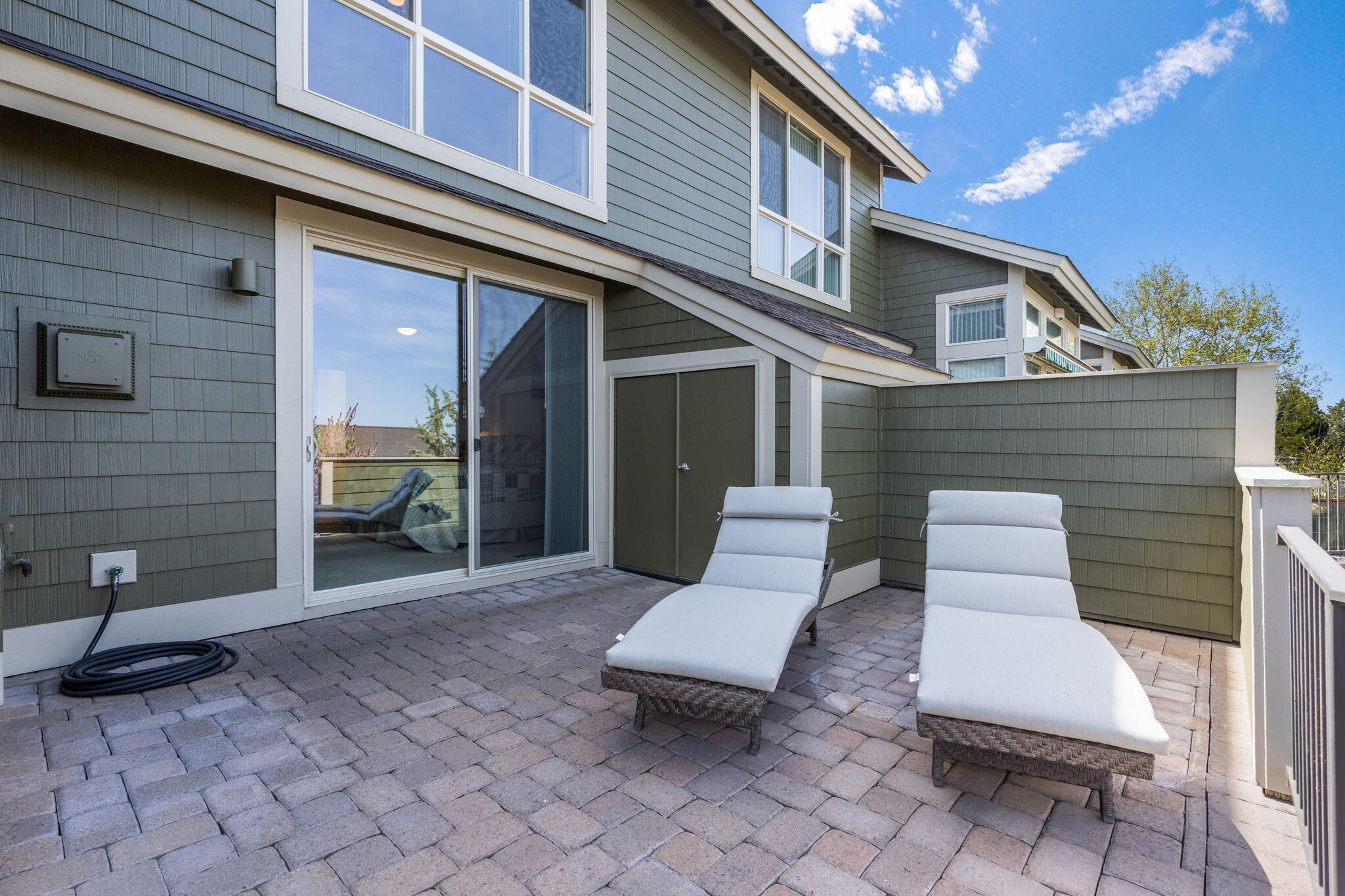 10870 Village Loop Redmond, OR 97756 - Photo 25 of 35 a view of a patio with table and chairs with wooden floor and fence
