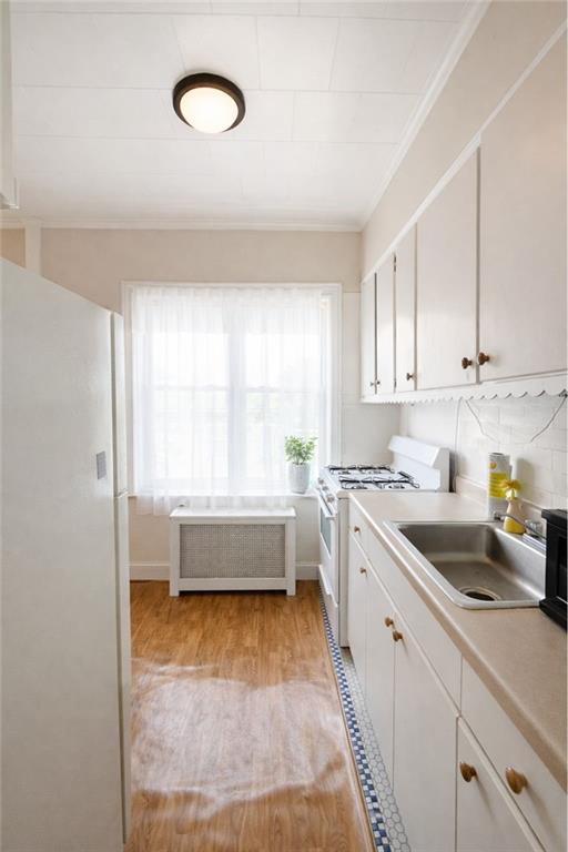 3923 Avenue R Brooklyn, NY 11234 - Photo 17 of 23 a view of a kitchen with a sink and dishwasher next to a window