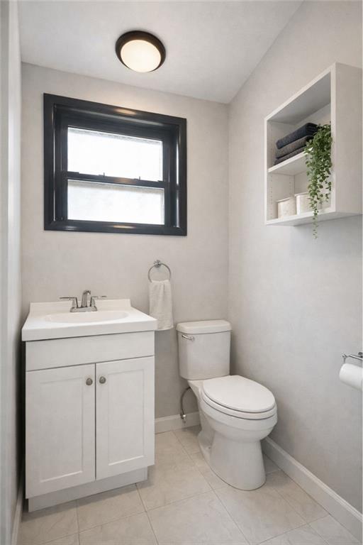 3923 Avenue R Brooklyn, NY 11234 - Photo 21 of 23 a bathroom with a toilet sink and mirror