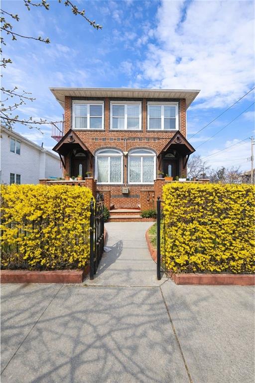 3923 Avenue R Brooklyn, NY 11234 - Photo 3 of 23 front view of a house with a large window