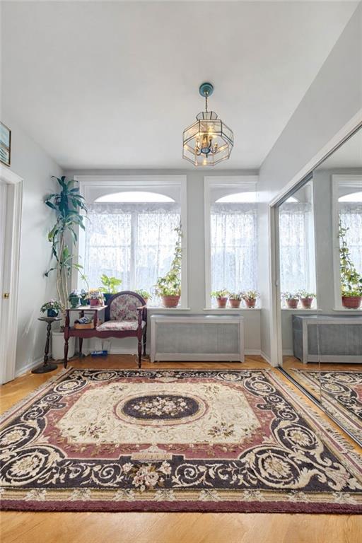3923 Avenue R Brooklyn, NY 11234 - Photo 6 of 23 a living room with furniture and a chandelier