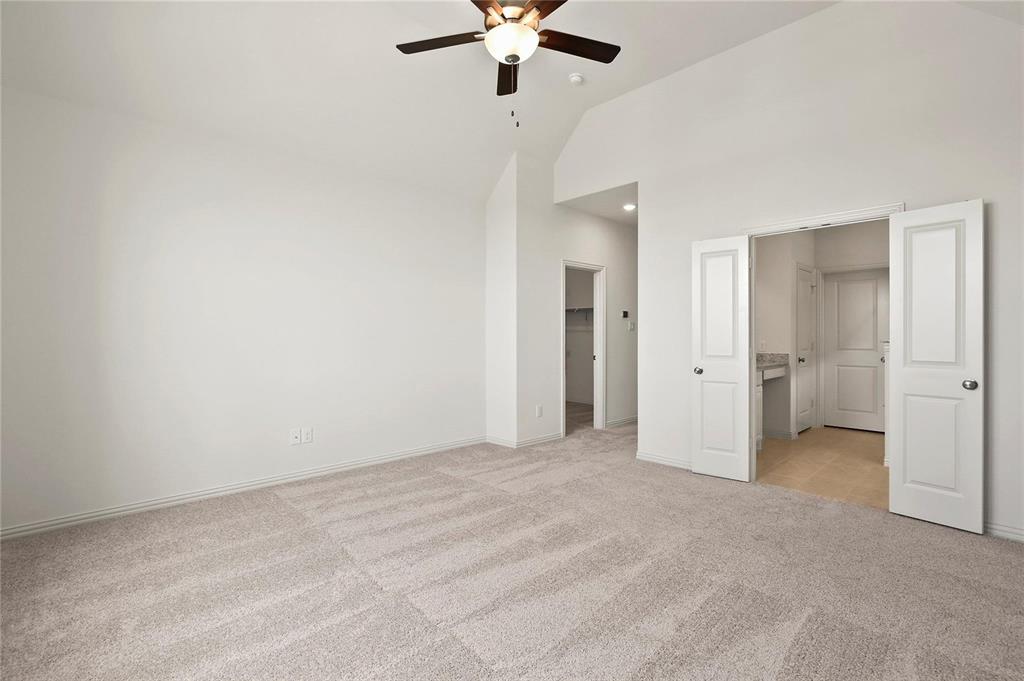 4721 Smokey Quartz Lane Arlington, TX 76005 - Photo 12 of 17 a view of an empty room with a ceiling fan