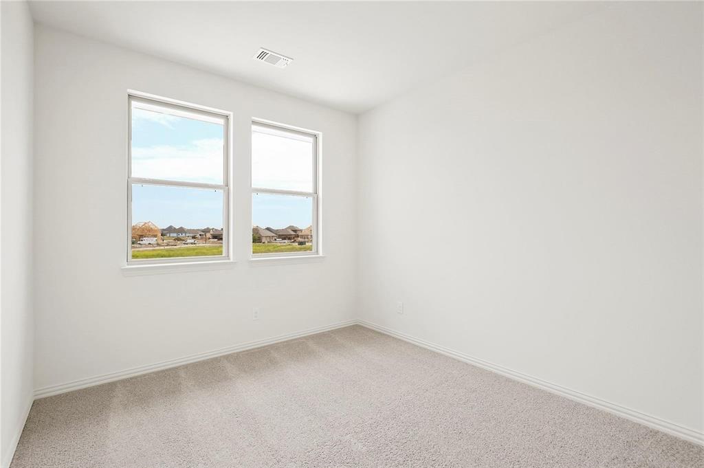 4721 Smokey Quartz Lane Arlington, TX 76005 - Photo 16 of 17 an empty room with windows