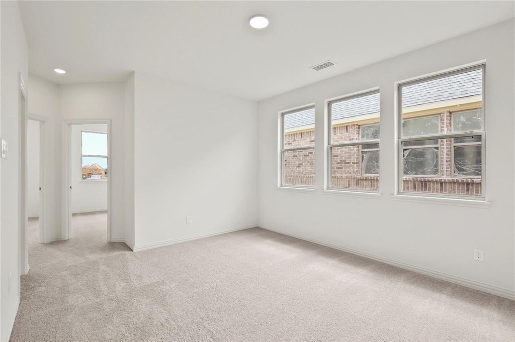 4721 Smokey Quartz Lane Arlington, TX 76005 - Photo 10 of 17 an empty room with windows