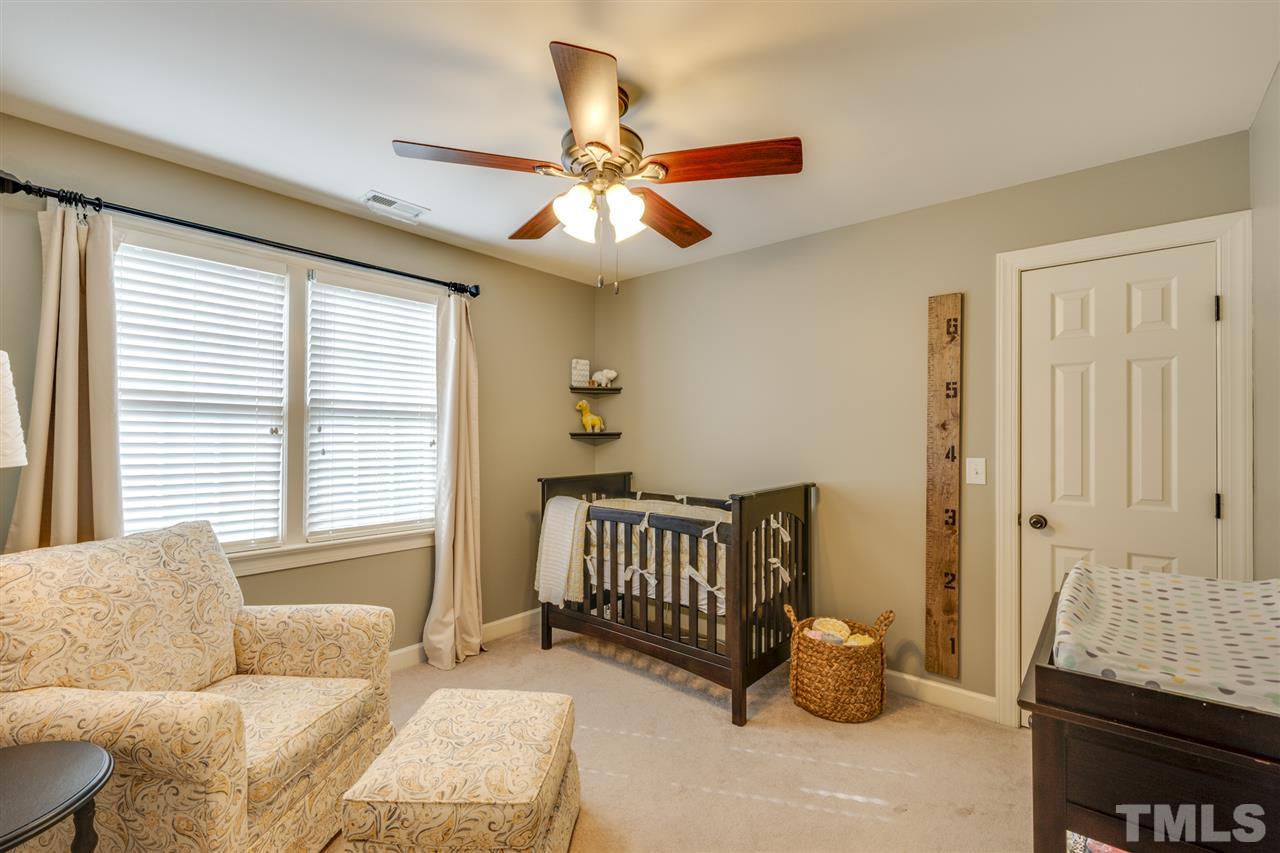 7905 Pine Timber Drive Raleigh, NC 27613 - Photo 14 of 19 a bedroom with furniture and a window