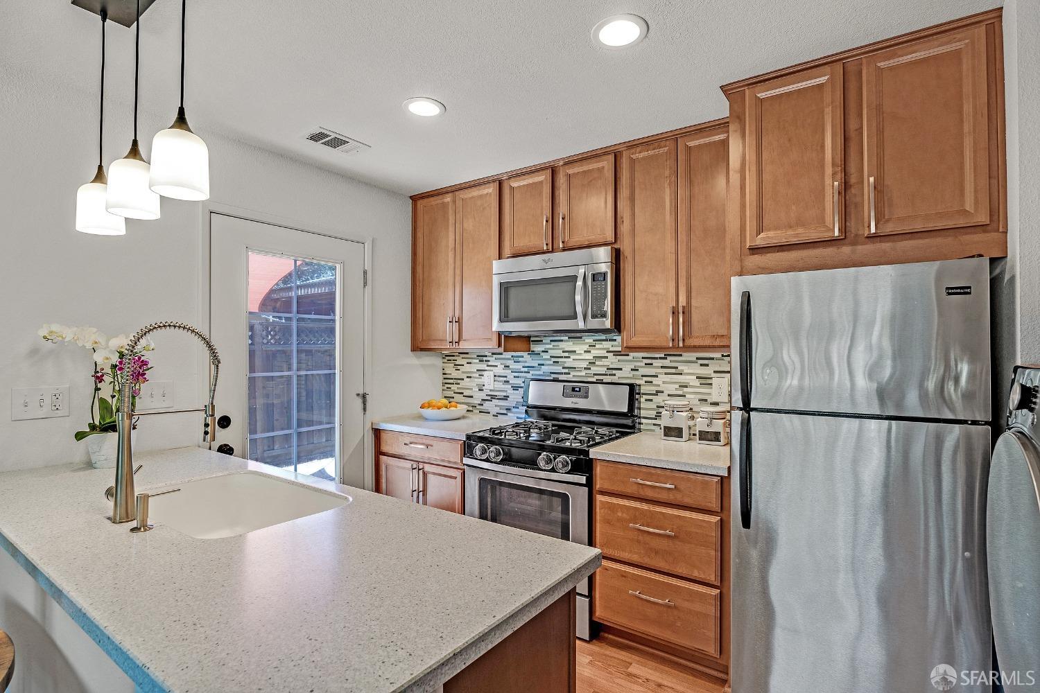 1780 Peary Way Livermore, CA 94550 - Photo 9 of 38 a kitchen with a sink stainless steel appliances and cabinets