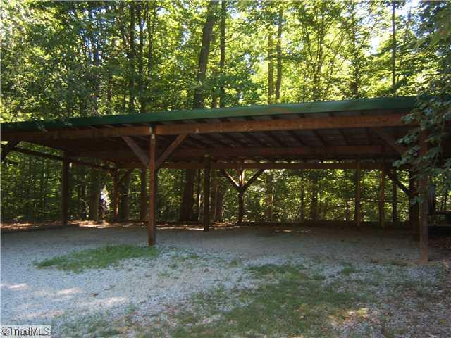 1611 Nighthawk Road Asheboro, NC 27205 - Photo 14 of 16 Exterior Front. 4 car detached carport