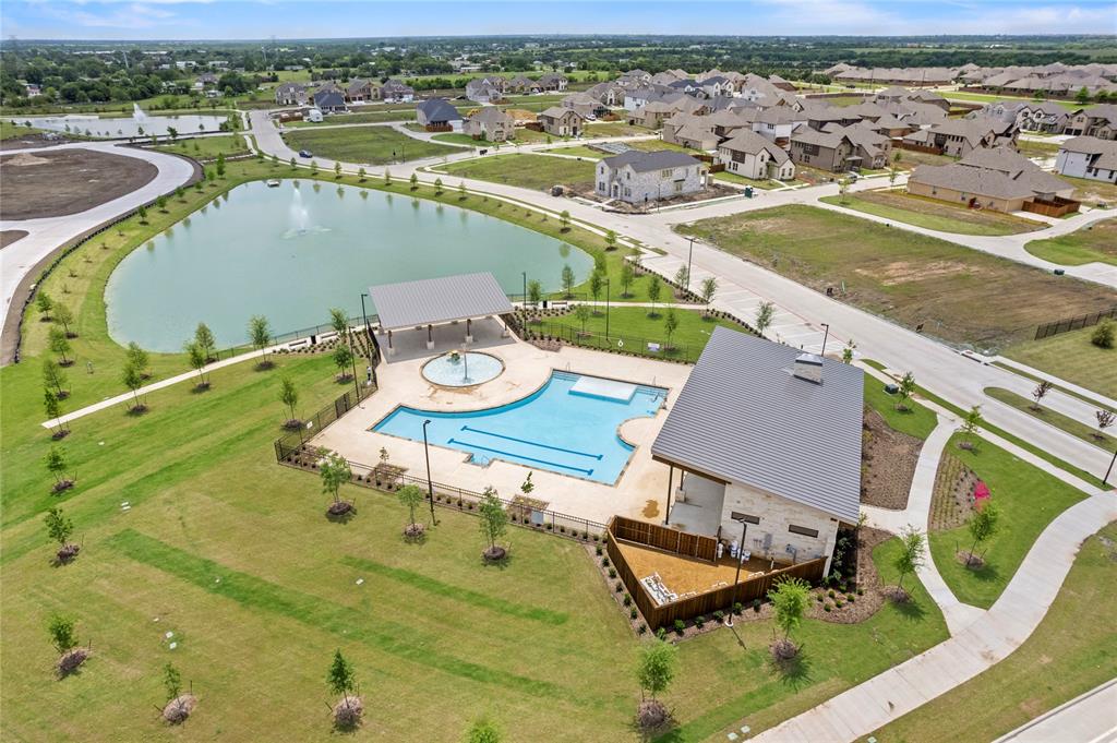 656 Blakelys Way Fate, TX 75189 - Photo 19 of 22 an aerial view of a swimming pool with outdoor seating and yard
