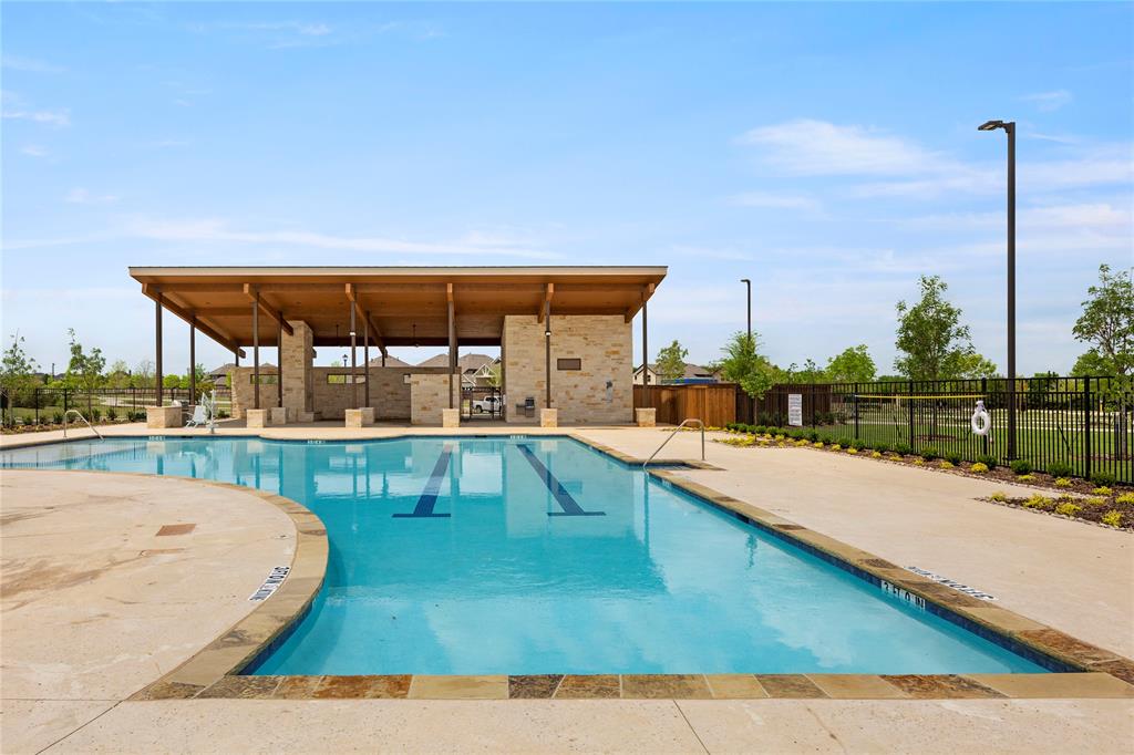 656 Blakelys Way Fate, TX 75189 - Photo 20 of 22 a view of a swimming pool with a patio