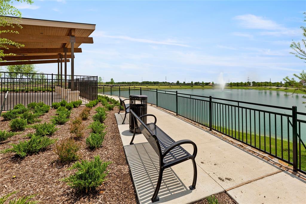 656 Blakelys Way Fate, TX 75189 - Photo 22 of 22 a view of swimming pool with outdoor seating and city view