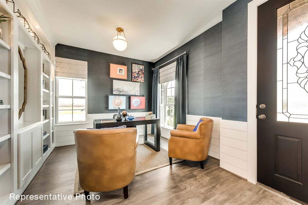 656 Blakelys Way Fate, TX 75189 - Photo 7 of 22 a living room with furniture and a large window