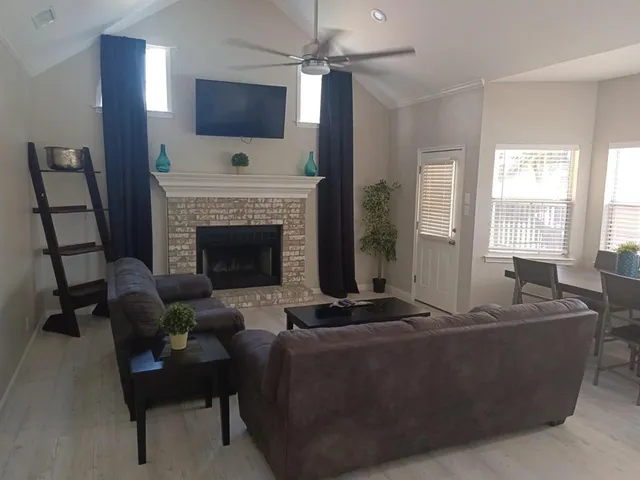 a swimming pool with outdoor seating and yard