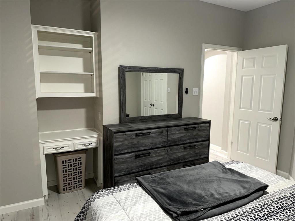 520 Red River Road Belton, TX 76513 - Photo 6 of 16 a room with a dresser and a wooden floor