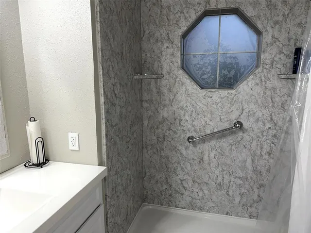 a bathroom with a sink and mirror