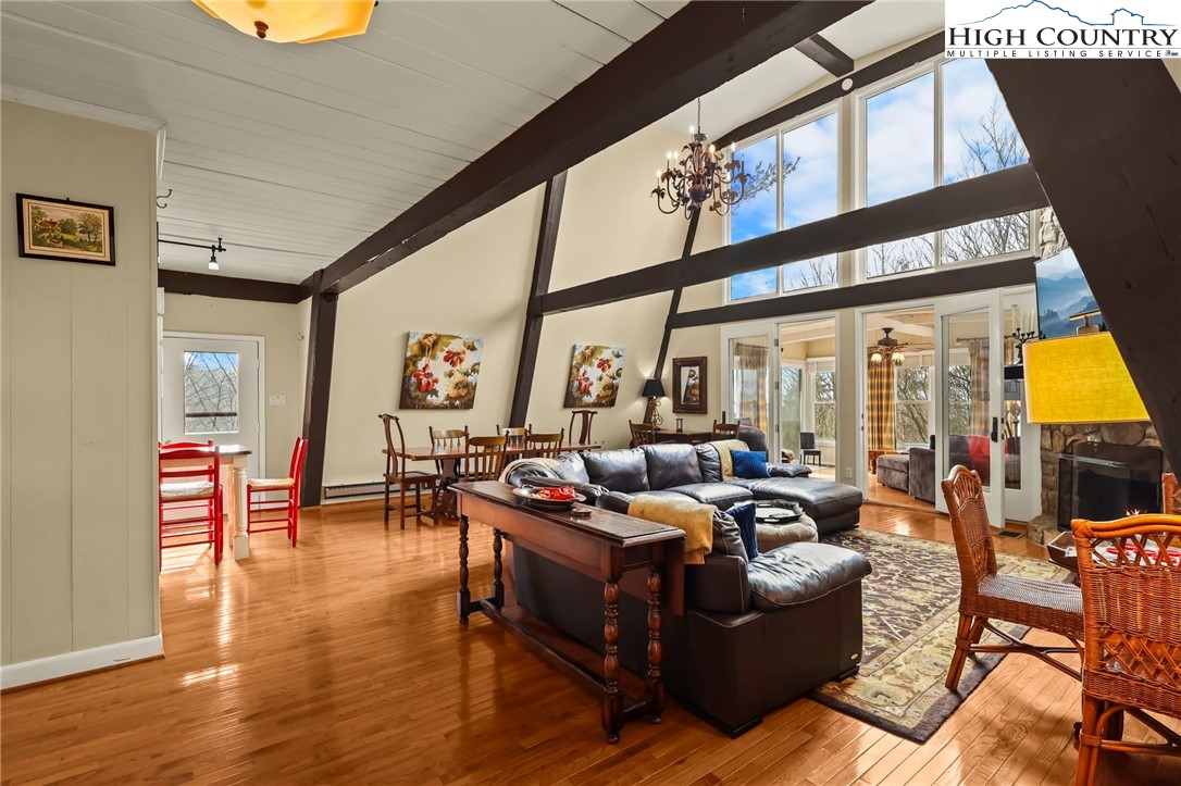 207 Pinnacle Ridge Road Beech Mountain, NC 28604 - Photo 11 of 48 a living room with furniture and large windows