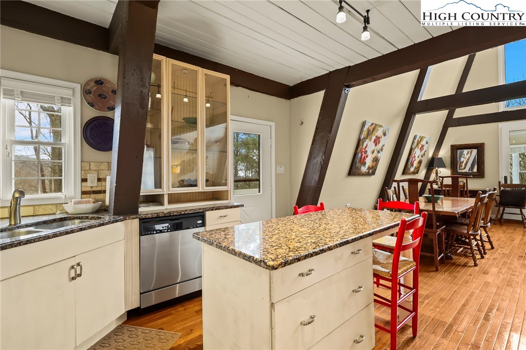 207 Pinnacle Ridge Road Beech Mountain, NC 28604 - Photo 13 of 48 a kitchen that has a lot of cabinets in it