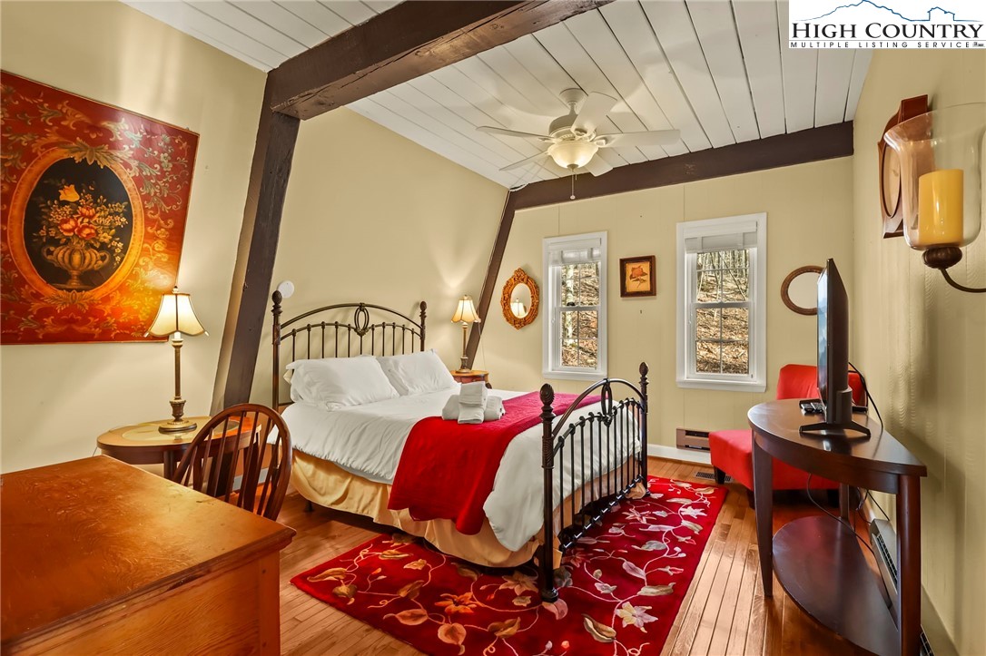 207 Pinnacle Ridge Road Beech Mountain, NC 28604 - Photo 26 of 48 a bedroom with furniture and wooden floor
