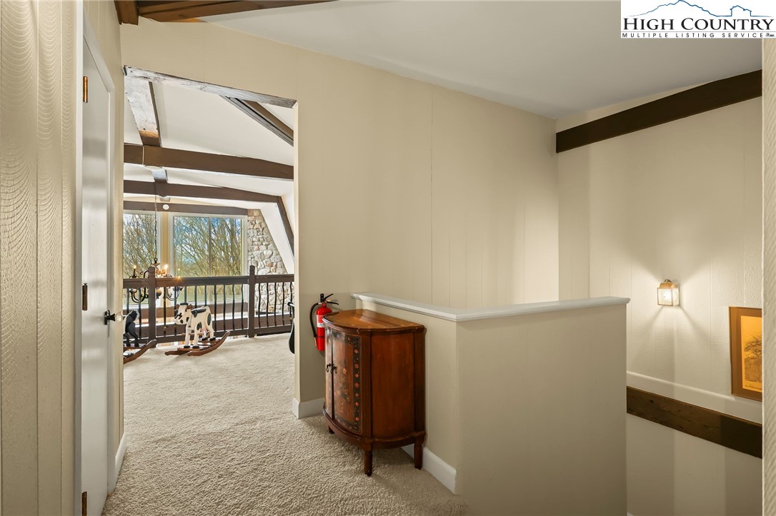 207 Pinnacle Ridge Road Beech Mountain, NC 28604 - Photo 32 of 48 a room with gym equipment and view of living room