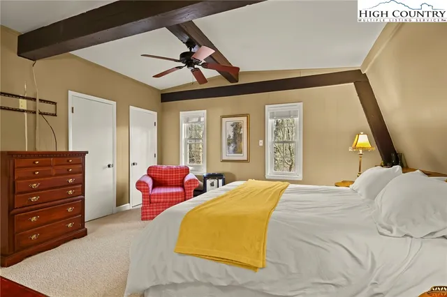 a bathroom with a sink a mirror and a shower