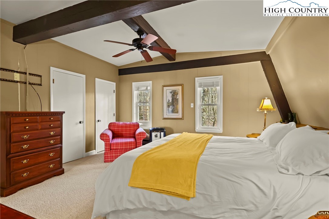 207 Pinnacle Ridge Road Beech Mountain, NC 28604 - Photo 39 of 48 a bedroom with a bed and wooden floor
