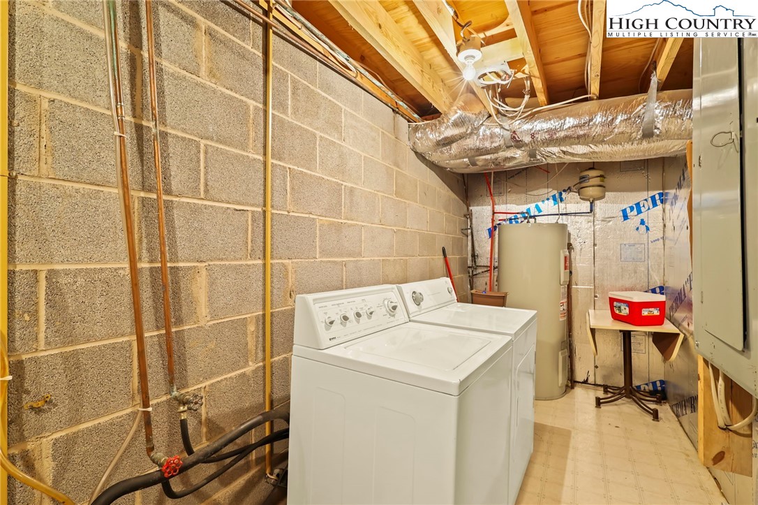 207 Pinnacle Ridge Road Beech Mountain, NC 28604 - Photo 47 of 48 a utility room with dryer and washer