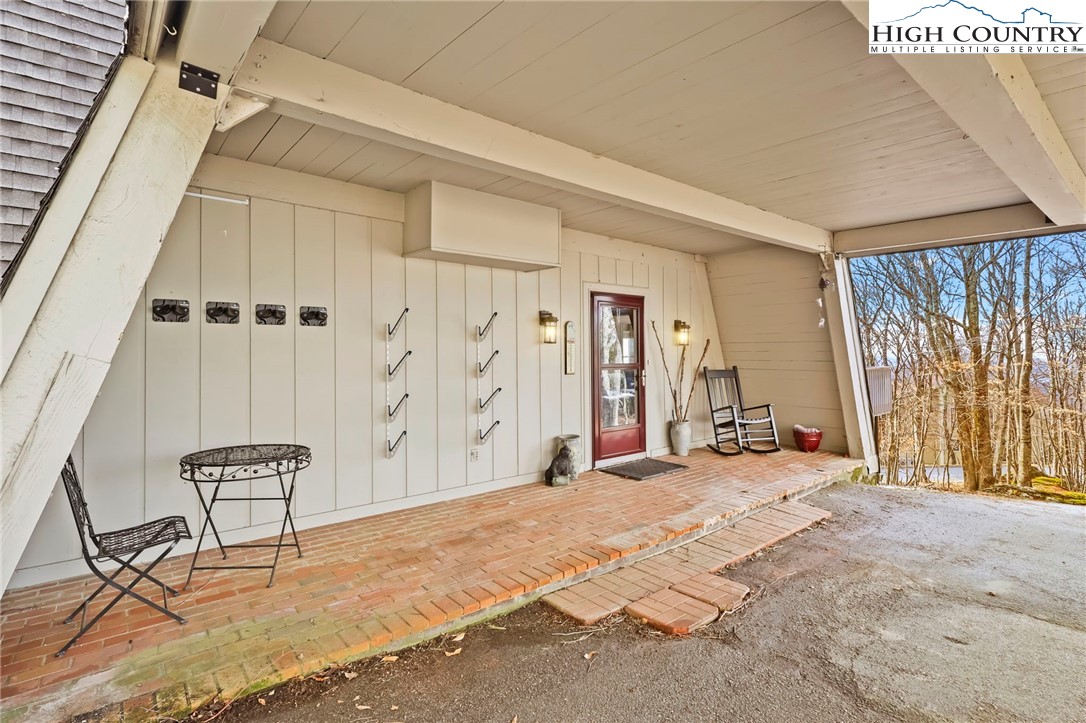 207 Pinnacle Ridge Road Beech Mountain, NC 28604 - Photo 5 of 48 a view of a bedroom with furniture and staircase