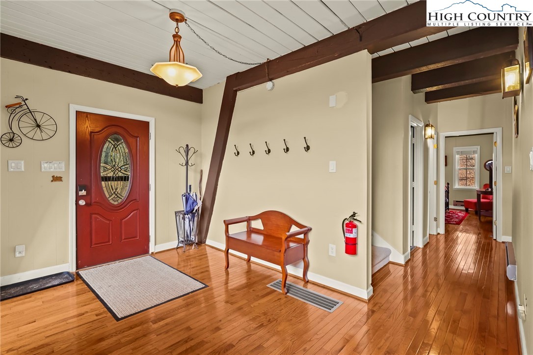 207 Pinnacle Ridge Road Beech Mountain, NC 28604 - Photo 6 of 48 a view of an entryway with wooden floor