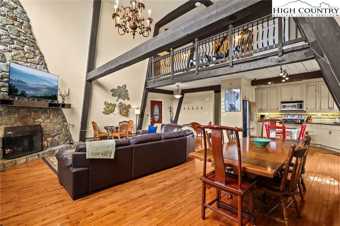 207 Pinnacle Ridge Road Beech Mountain, NC 28604 - Photo 8 of 48 a living room with furniture a fireplace and a counter top space