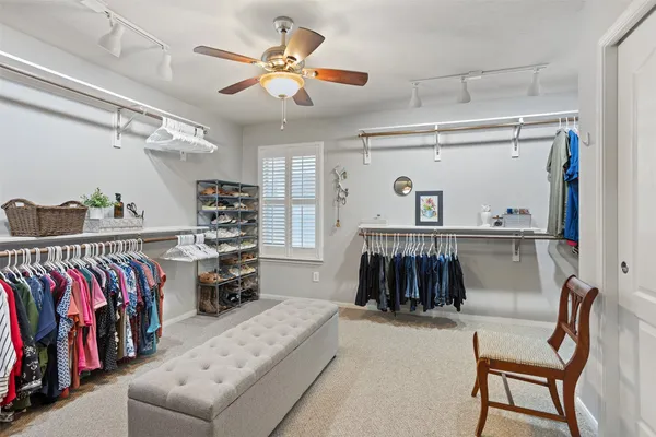 a view of a patio with a table and chairs under an umbrella