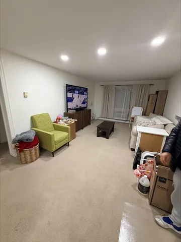 a bed room with furniture and a flat screen tv