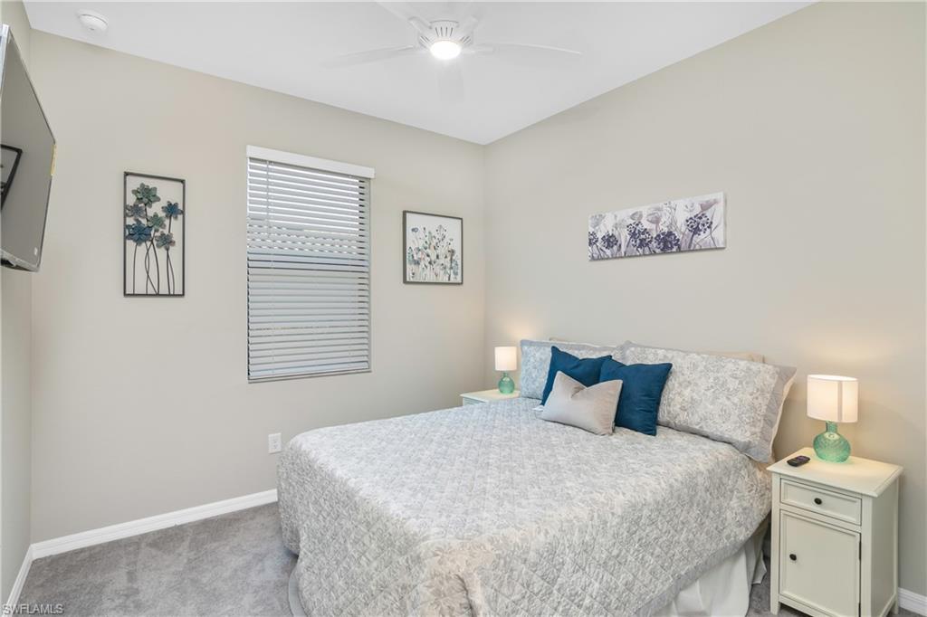 19828 The Pl Boulevard Estero, FL 33928 - Photo 15 of 37 a bedroom with a bed and a window