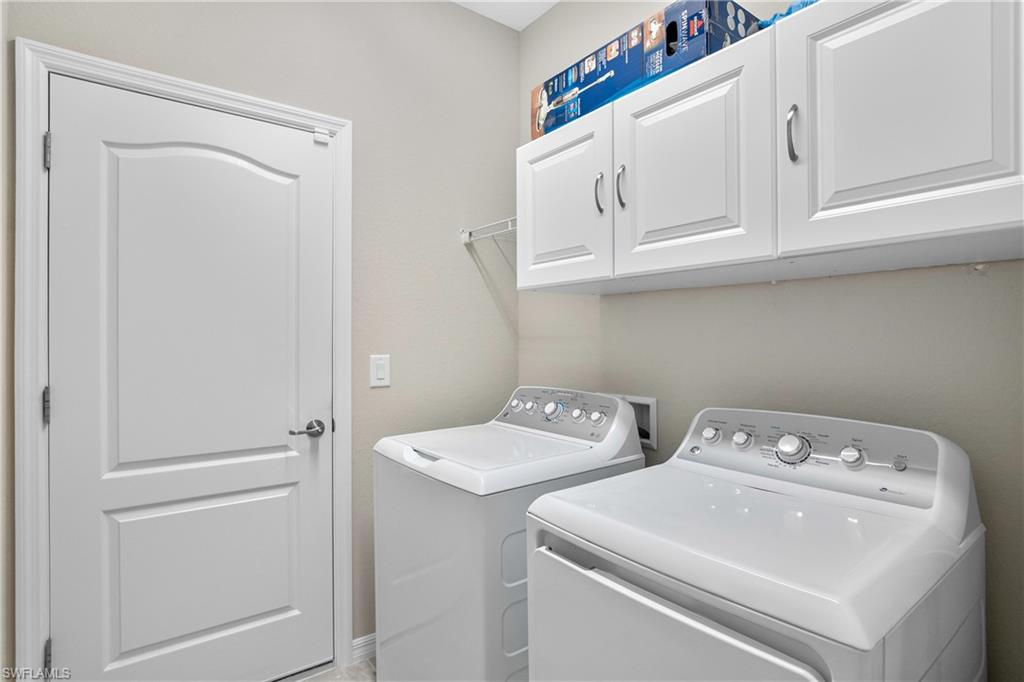 19828 The Pl Boulevard Estero, FL 33928 - Photo 20 of 37 a utility room with dryer and washer