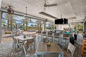 19828 The Pl Boulevard Estero, FL 33928 - Photo 28 of 37 a room with lots of table and chairs