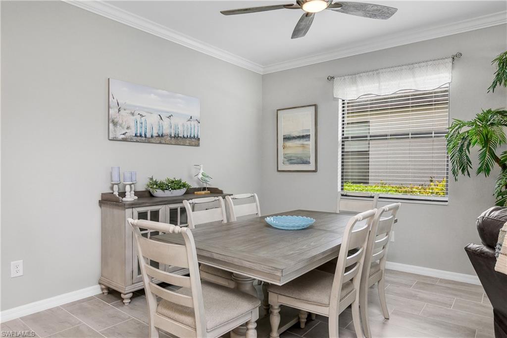 19828 The Pl Boulevard Estero, FL 33928 - Photo 7 of 37 a view of a dining room with furniture and window