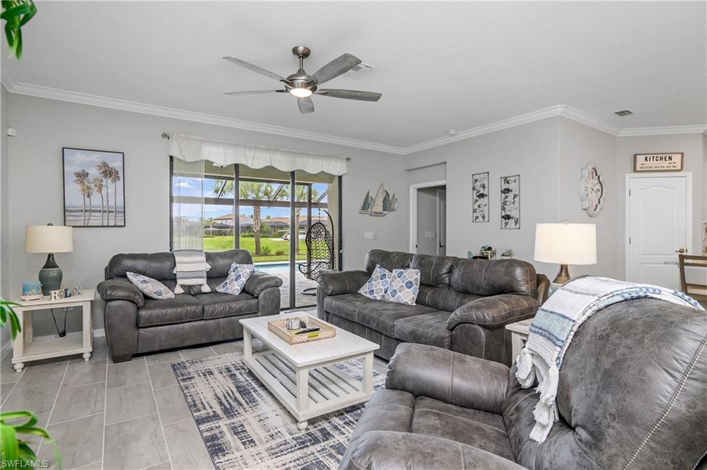 19828 The Pl Boulevard Estero, FL 33928 - Photo 8 of 37 a living room with furniture and a large window