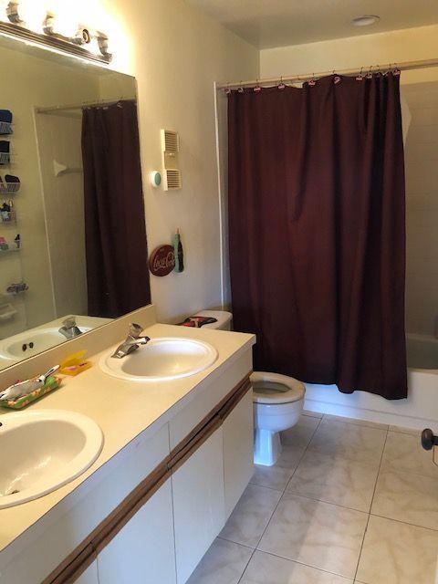 5310 Elmhurst Road, Unit E West Palm Beach, FL 33417 - Photo 13 of 24 Master bathroom with duel sinks