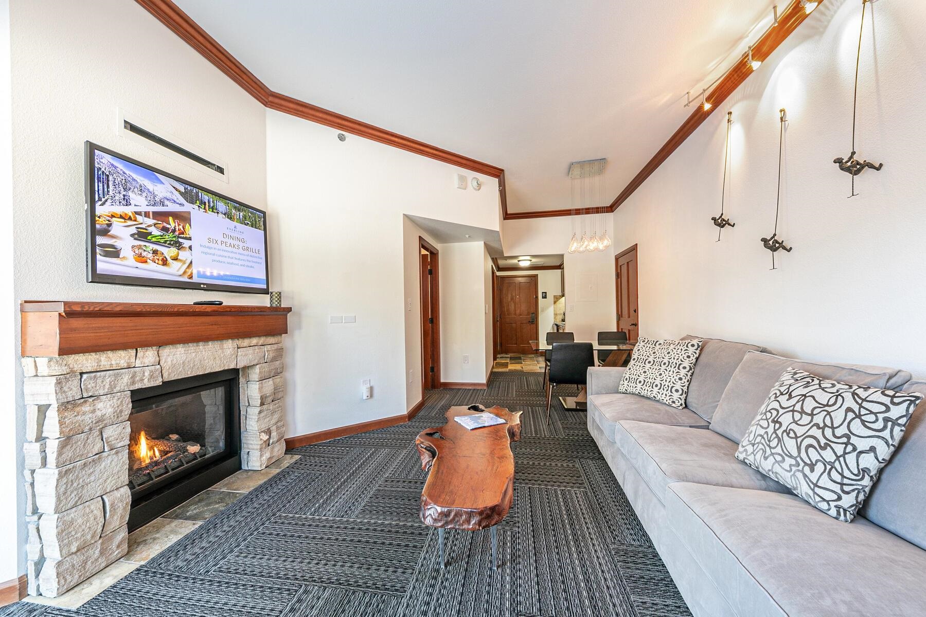 400 Resort Road, Unit 118 120 Olympic Valley, CA 96146 - Photo 6 of 27 a living room with furniture and a fireplace