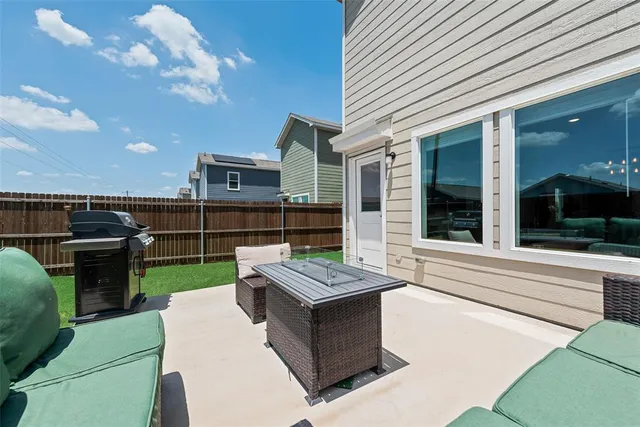 a view of a terrace with furniture