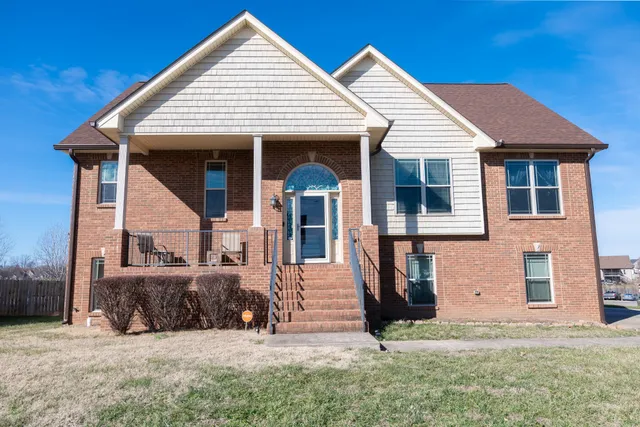 a view of a house with large outdoor space and windows