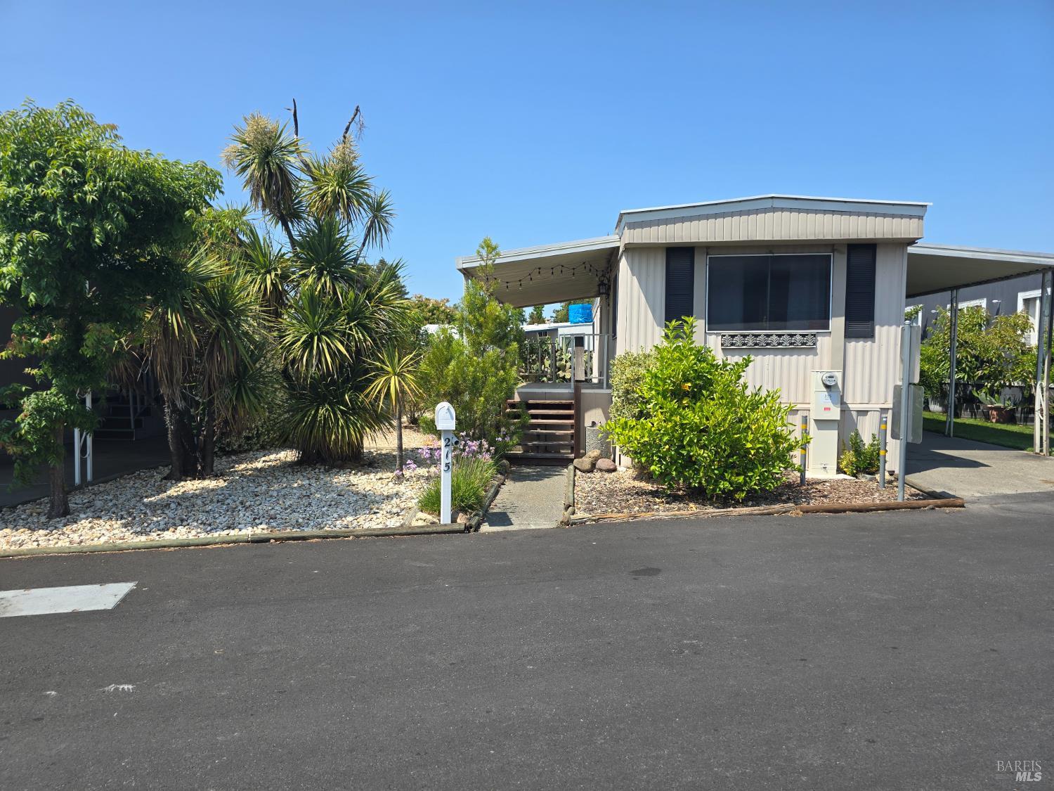 215 Apple Lane Santa Rosa, CA 95407 - Photo 1 of 1 a front view of a house with a yard and a garage