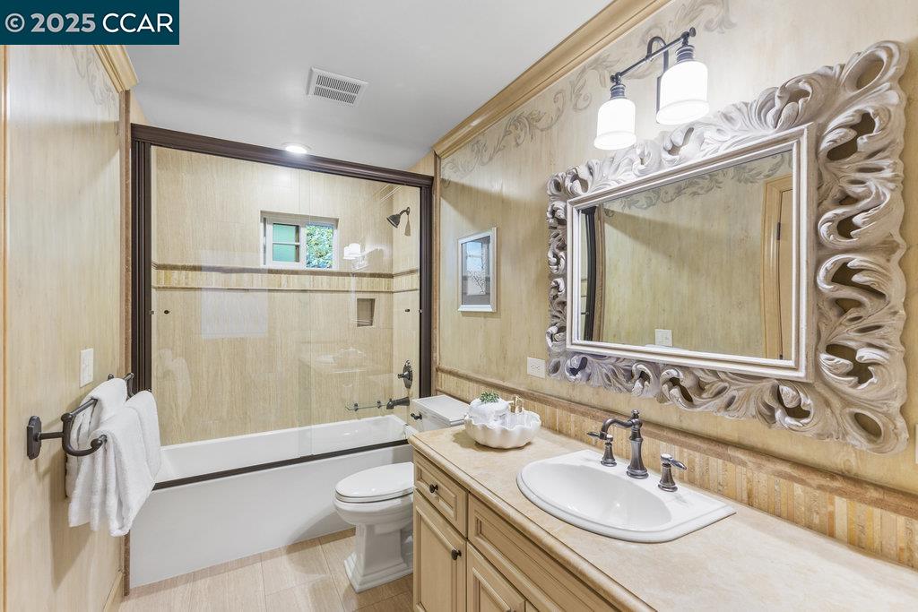 1111 Stone Valley Road Alamo, CA 94507 - Photo 16 of 47 a bathroom with a sink a toilet and shower