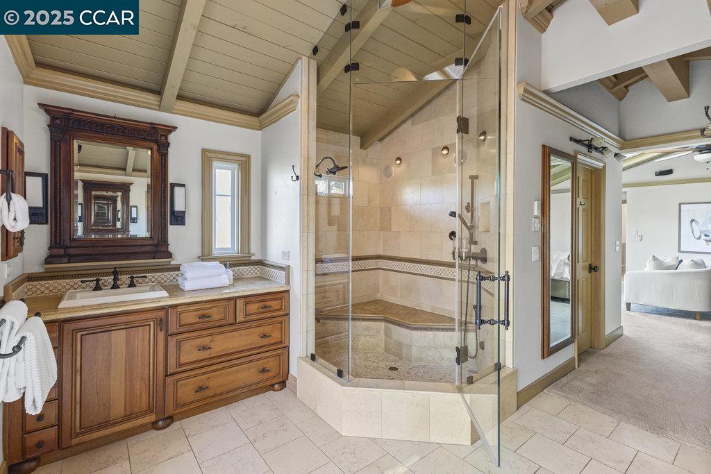 1111 Stone Valley Road Alamo, CA 94507 - Photo 21 of 47 a bathroom with a granite countertop sink a mirror and a shower