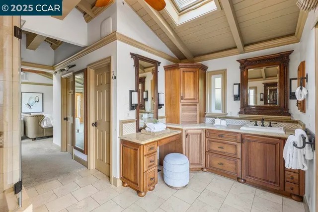 a kitchen with a sink and wooden cabinets