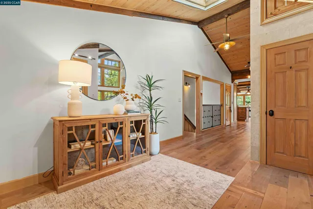 a view of an entryway with wooden floor