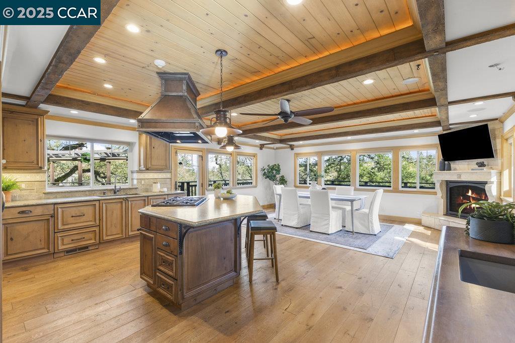 1111 Stone Valley Road Alamo, CA 94507 - Photo 9 of 47 a kitchen with a stove and a white cabinets with wooden floor